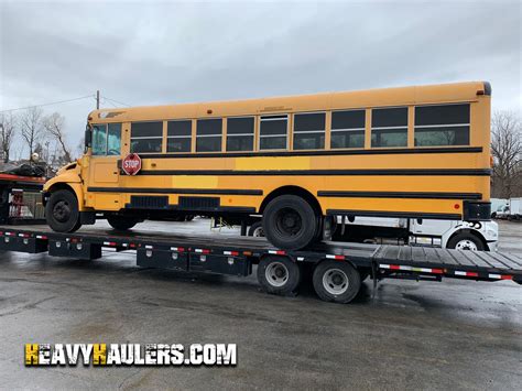 school bus skid steer hauler|school bus transportation.